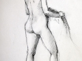 Female nude standing with chair
