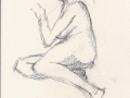 Nude sitting.